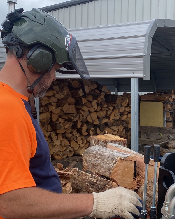 Tree crew splitting woods for firewood use in Edwardsburg, MI.